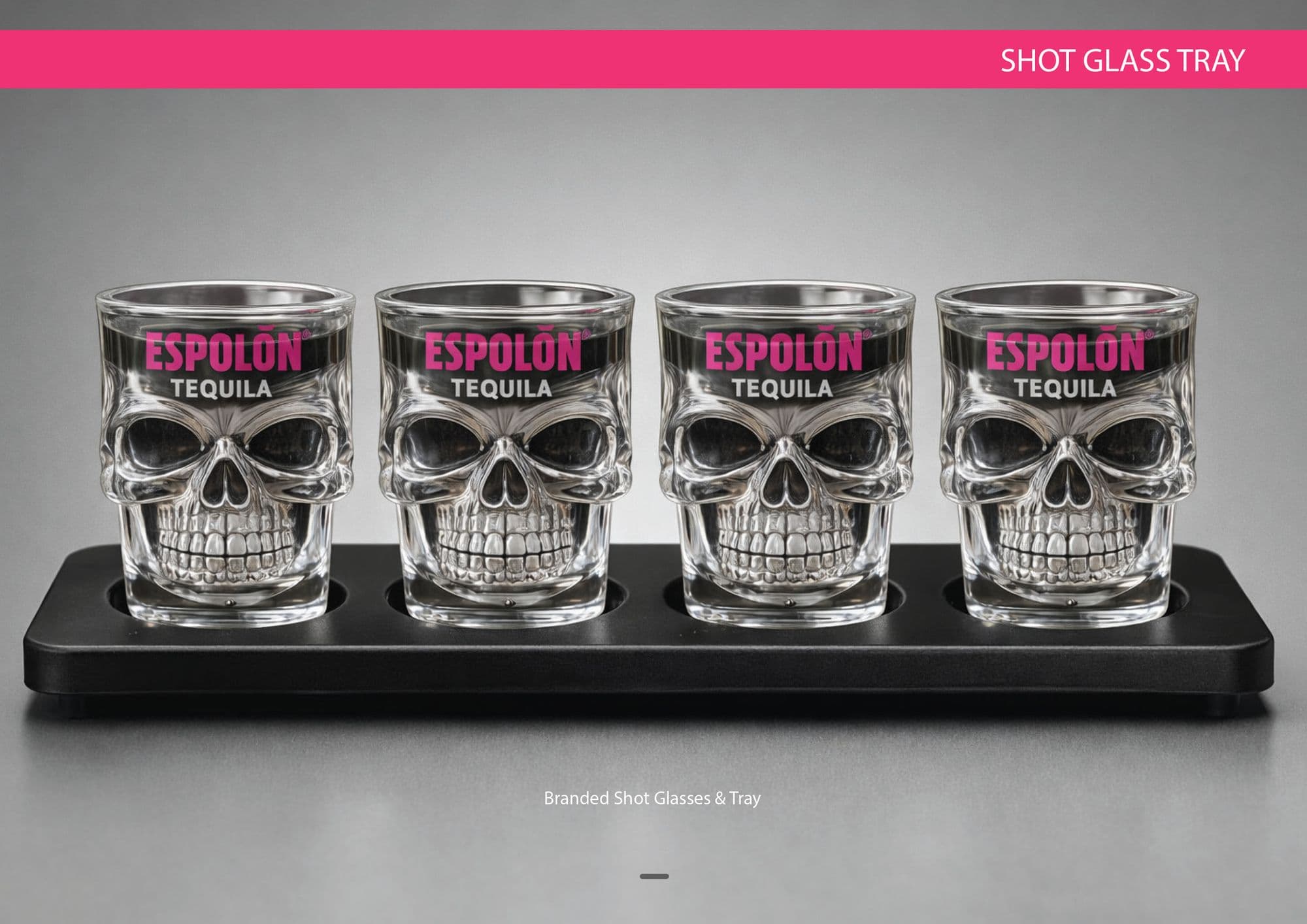 Shot glass tray page: four skull-shaped Espolòn Tequila shot glasses standing in a black tray